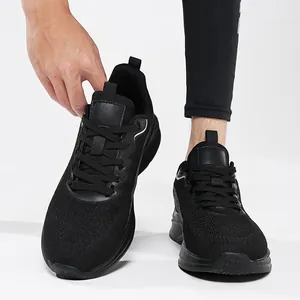 Detailed view of men's black breathable flyknit running shoes worn for casual exercise