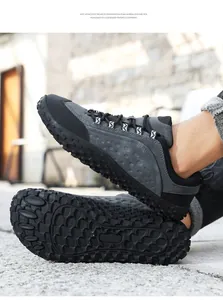 Detailed view of durable leather outdoor shoes with anti-slip wide-toe EVA soles.