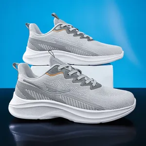 Close-up detail of grey mesh breathable running shoes on a white platform display