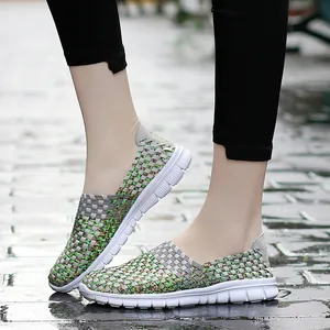 Detail view of breathable elastic woven slip-on loafers for women on pavement