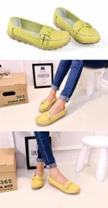 Close-up detail of lime green genuine leather loafers with decorative buckle and white stitching