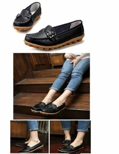 Black leather flat loafers for women with decorative buckle and comfort rubber sole.
