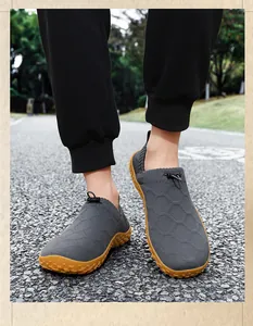 Detail view of breathable flyknit barefoot shoes for men with slip-on design and gum sole.