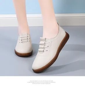 Detail of soft-soled beige leather loafers for women with textured non-slip rubber sole