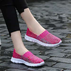 Breathable woven elastic slip-on sneakers for women in vibrant magenta and white sole