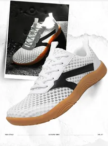 Close-up view of white breathable mesh sneakers for men featuring a classic gum sole