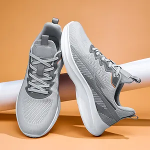 Detailed view of gray flyknit running shoes with breathable mesh and white sole