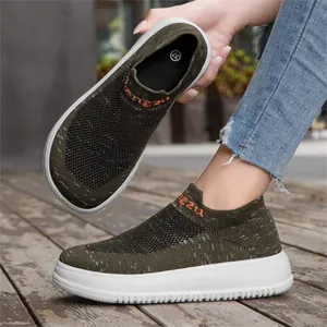 Macro detail view of olive green breathable knitted fly-knit slip-on sneakers for women