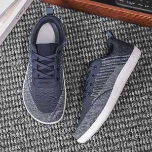 Close-up of navy blue breathable knit barefoot shoes with wide toe box design