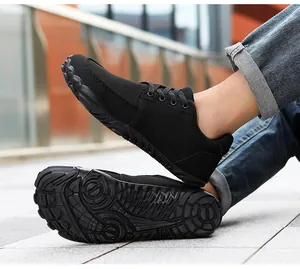 Black barefoot hiking shoes with breathable mesh and anti-slip sole detail