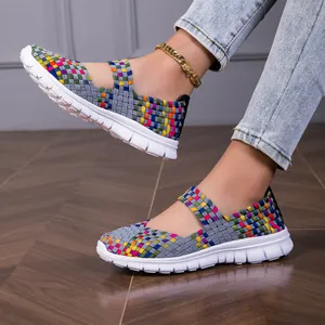 Close-up of colorful woven elastic band sandals with lightweight white sole for women