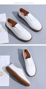 Detailed view of white minimalist leather loafers with durable soft rubber soles