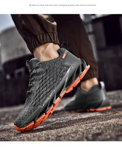 Close-up view of lightweight breathable fly-knit men's running shoes with orange blade sole
