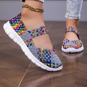 Close-up of colorful woven elastic Mary Jane flats with lightweight white soles