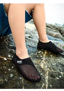 Close-up detail of black mesh beach shoes for outdoor water sports and swimming