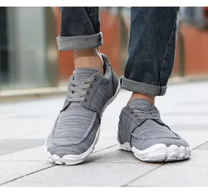 Close-up of grey breathable mesh loafers with wide toe box design for men