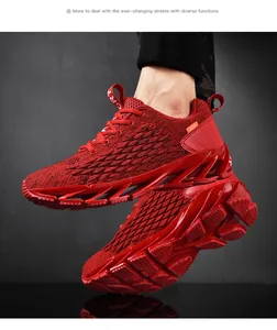 Close-up of vibrant red breathable flyknit men's running shoes with blade sole.