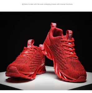 Detail view of breathable red knit blade running shoes for men with lace-up design