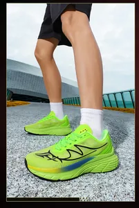 Low angle detail of neon green mesh running shoes for men in an outdoor setting