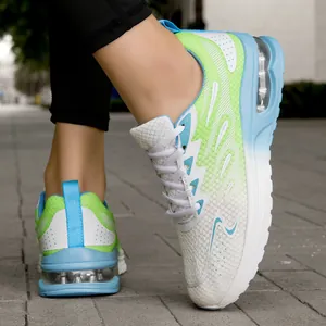 Close-up of breathable fly-knit women's running shoes with blue air cushion shock-absorbing sole.