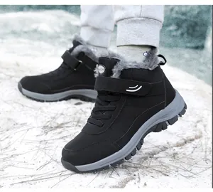 Detailed macro shot of black winter snow boots with thick fur lining and velcro strap
