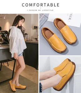 Detail shot of yellow breathable leather loafers for women showing stitching.