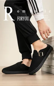 Close-up of comfortable black fleece-lined Birken-style slippers with buckle detail
