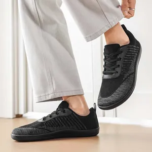 Detail view of breathable black knit barefoot shoes featuring a comfortable wide toe box