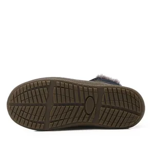 Close-up view of the slip-resistant rubber sole on classic winter fur-lined snow boots