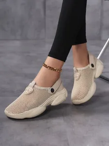 Detail of women's breathable beige mesh clogs with thick non-slip soles for summer wear