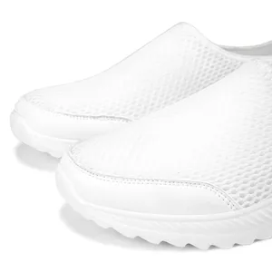 Close-up detail of white breathable fly-knit mesh fabric on men's lightweight slip-on walking shoes