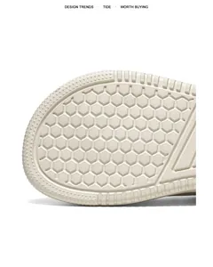 Close-up of men's trainer shoe sole with anti-slip honeycomb texture and star motifs