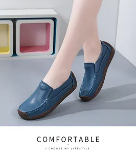 Detailed side view of blue leather loafers on model for casual everyday wear