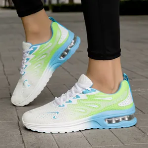 Close-up detail of women's breathable air cushion running shoes with green gradient mesh