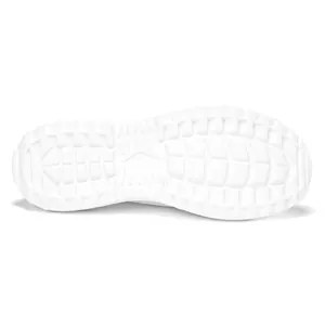 Close-up view of the white textured anti-slip rubber sole of a breathable casual sneaker