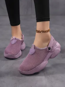 Detailed view of breathable purple mesh platform clogs for women