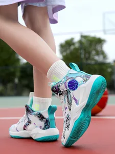 Detailed view of white and teal kids' basketball sneakers worn on an outdoor court