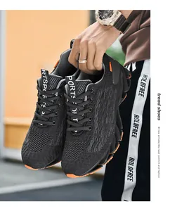 High-performance black mesh running shoes for men featuring stylish orange blade soles