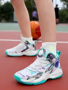 Detail shot of kids' high-top basketball shoes with colorful graffiti patterns on court.
