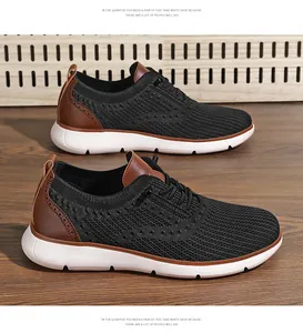 Side view of black breathable fly-knit men's business casual shoes with brown trim