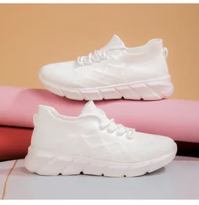 Detailed side view of stylish white platform sneakers with breathable mesh upper