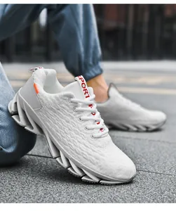 Detailed side view of white mesh running shoes featuring a unique blade sole design