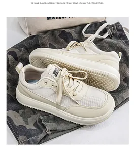 Close-up view of the breathable mesh and wide toe design on these cream casual sneakers.