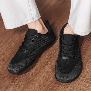 Breathable barefoot shoes with a wide toe box for men and women, black knit style.