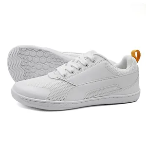 Retro white GAT sneakers featuring mesh panels and a distinctive hexagonal sole pattern