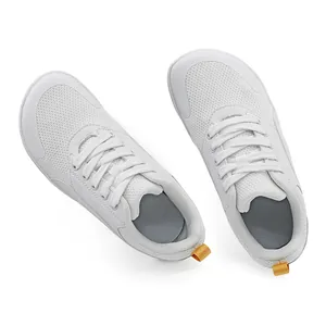 Top-down view of white minimalist barefoot sneakers with breathable mesh upper