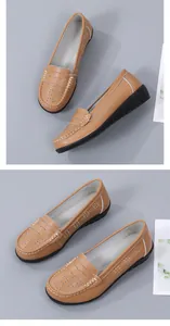 Close-up detail of tan hollow-out women's loafers featuring decorative white stitching
