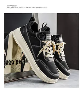 Close-up of black breathable wide-toe sneakers with cream laces and thick soles