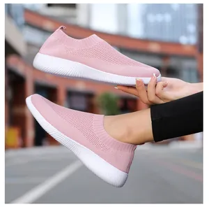 Detail view of pink mesh walking shoes for women with breathable knit upper