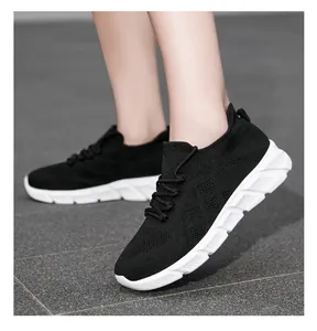 Detail view showing the comfort and fit of women's black knit breathable fashion sneakers